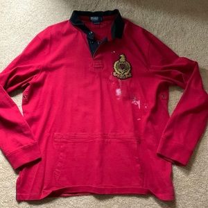 Polo, rugby style, pullover. Distressed designs, pocket on front